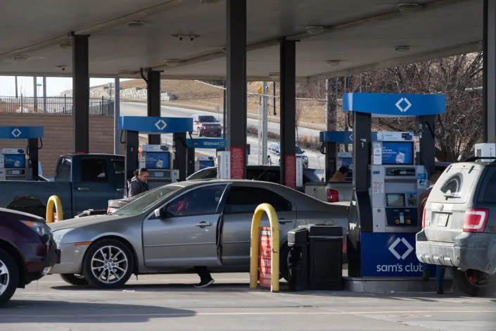 A steady stream of vehicles pump gas Friday at the Sam's Club gas station, 1401 S.W. Wanamaker Road.