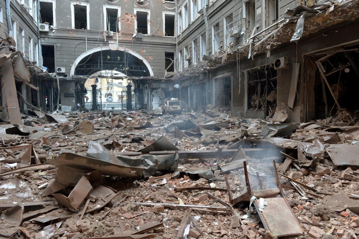 A picture shows damages in a building entrance after the shelling by Russian forces of Constitution Square in Kharkiv, Ukraine's second-biggest city, on March 2, 2022. - On the seventh day of fighting in Ukraine on March 2, Russia claims control of the southern port city of Kherson, street battles rage in Ukraine's second-biggest city Kharkiv, and Kyiv braces for a feared Russian assault. (Photo by Sergey BOBOK / AFP) (Photo by SERGEY BOBOK/AFP via Getty Images)