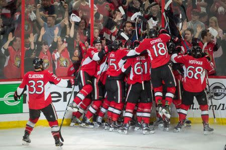 Apr 29, 2017; Ottawa, Ontario, CAN; The Ottawa Senators celebrate their win against the New York Rangers in the second overtime of game two in the second round of the 2017 Stanley Cup Playoffs at Canadian Tire Centre. Mandatory Credit: Marc DesRosiers-USA TODAY Sports