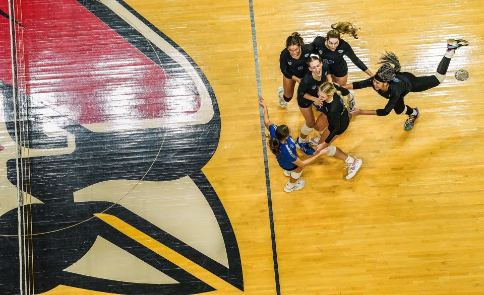 Hamilton Southeastern Royals celebrate a point Saturday, Nov. 4, 2023, during the IHSAA Class 4A state championship game at Worthen Arena in Muncie. The Hamilton Southeastern Royals defeated the Castle Knights, 3-1.