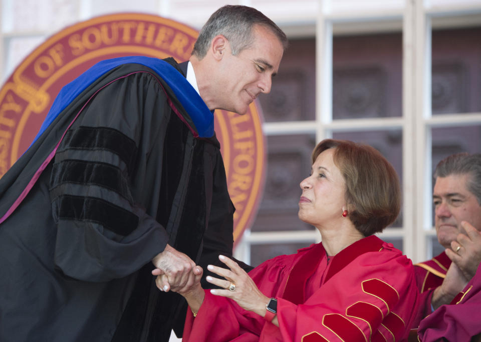 IMAGE DISTRIBUTED FOR USC - Los Angeles Mayor Eric Garcetti, left, congratulates USC President Carol L. Folt during Folt's inauguration on Friday Sept. 20, 2019 in Los Angeles. (Phil McCarten/AP Images for USC)