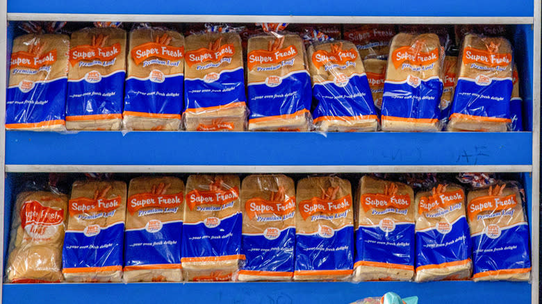 Loaves of white bread for sale at store