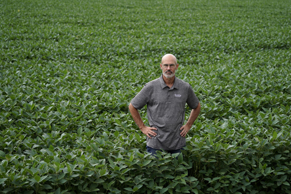 Jeff O'Connor poses for a photo at his farm, Thursday, Aug. 4, 2022, in Kankakee, Ill. A US Department of Agriculture move to change crop insurance rules to encourage farmers to grow two crops in a single year instead of one. Usually this means planting winter wheat in the fall, harvesting in May or June and then planting soybeans. The USDA is making it easier to obtain insurance, lessening the risk to farmers who make this choice.(AP Photo/Nam Y. Huh)