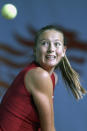 FILE - In this Jan. 3, 2003, file photo, Maria Sharapova of Russia eyes to the ball during her semifinal match against Monica Seles of the United States in the Hong Kong Ladies Challenge tennis tournament in Hong Kong. Sharapova is retiring from professional tennis at the age of 32 after five Grand Slam titles and time ranked No. 1. She has been dealing with shoulder problems for years. In an essay written for Vanity Fair and Vogue about her decision to walk away from the sport, posted online Wednesday, Feb. 26, 2020, Sharapova asks: “How do you leave behind the only life you’ve ever known?” (AP Photo/Vincent Yu, FIle)