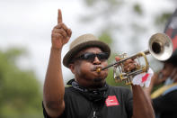 Members of the New Orleans Jazz Orchestra serenade healthcare workers at New Orleans East Hospital, as a tribute for their care of COVID-19 patients, outside the hospital in New Orleans, Friday, May 15, 2020. A New York woman collaborated with the New Orleans Jazz Orchestra to put on what she calls a stimulus serenade to give moral support to front-line hospital workers and COVID-19 patients in New Orleans. (AP Photo/Gerald Herbert)