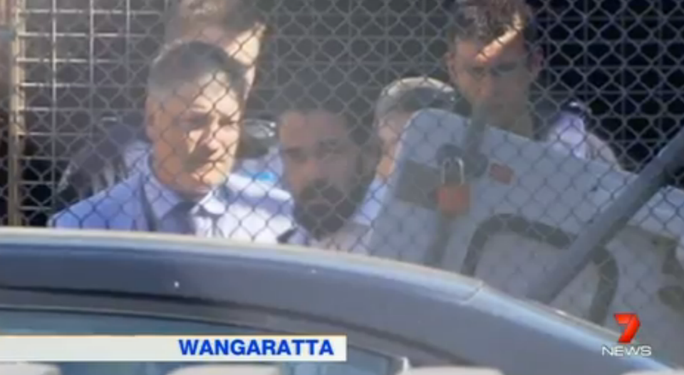 The 29-year-old walked calmly into the Wangaratta Magistrates Court dressed in a white button up shirt and surrounded by police. Photo: 7 News