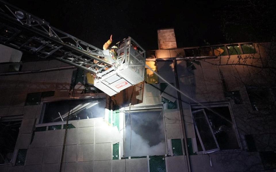 Rescuers work at the site where a building was damaged in the night by Russian drone strikes - STATE EMERGENCY SERVICE OF UKRAINE/via REUTERS