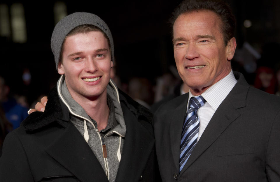 Arnold Schwarzenegger and son Patrick, left, arrive for the European Premiere of The Last Stand at a central London cinema in Leicester Square, Tuesday, Jan. 22, 2013. (Photo by Joel Ryan/Invision/AP)