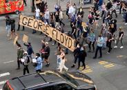 Protesters march to demonstrate against the death in Minneapolis police custody of George Floyd, on Flatbush Avenue in Brooklyn toward the Manhattan Bridge, New York