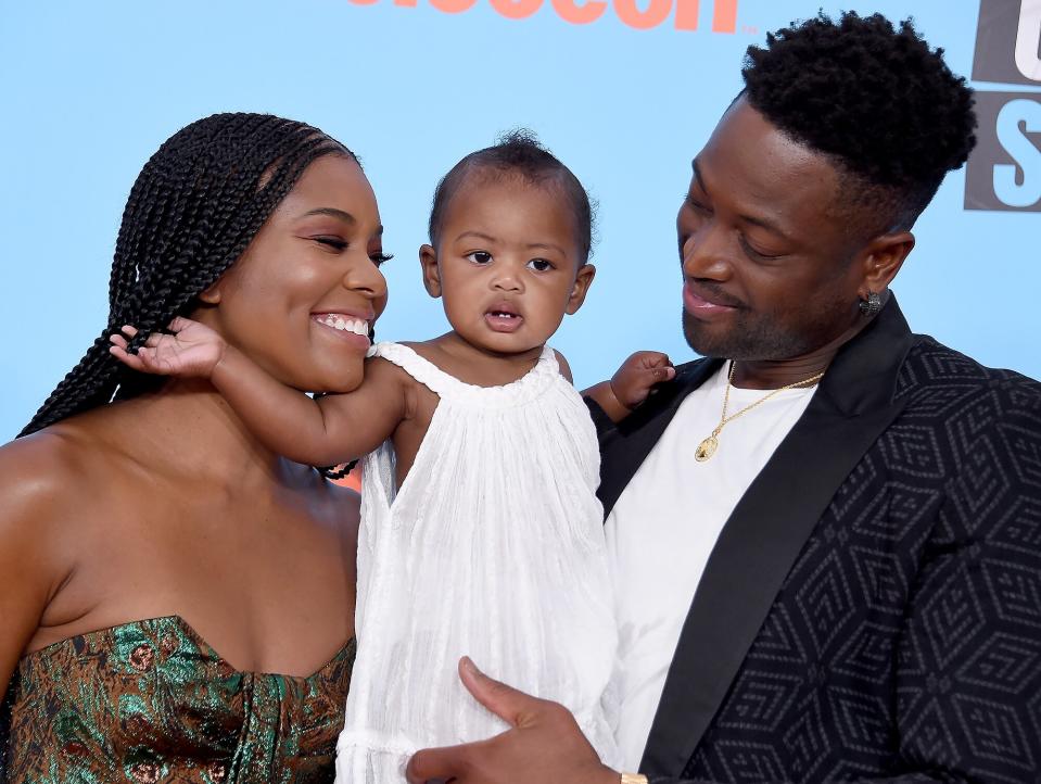 Gabrielle Union, Kaavia James Union Wade, and Dwyane Wade attend Nickelodeon Kids' Choice Sports 2019 at Barker Hangar on July 11, 2019 in Santa Monica, California