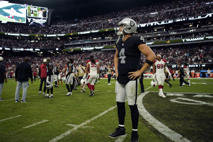 Las Vegas Raiders quarterback Derek Carr (4) stands on the field after an overtime loss to the Arizona Cardinals during an NFL football game Sunday, Sept. 18, 2022, in Las Vegas. (AP Photo/John Locher)