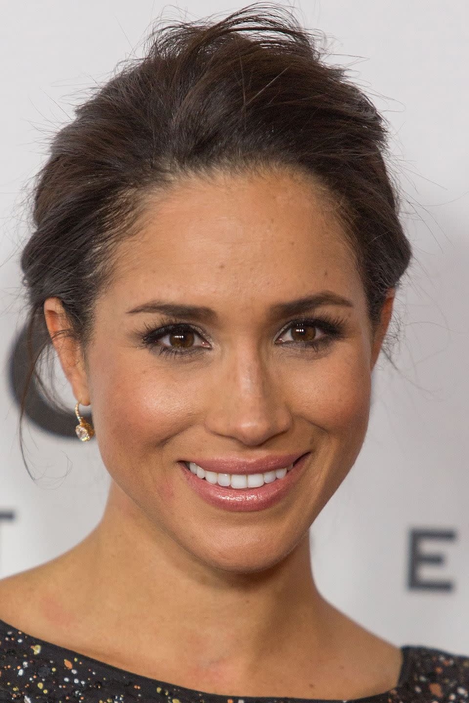 Meghan with an undone updo in 2013