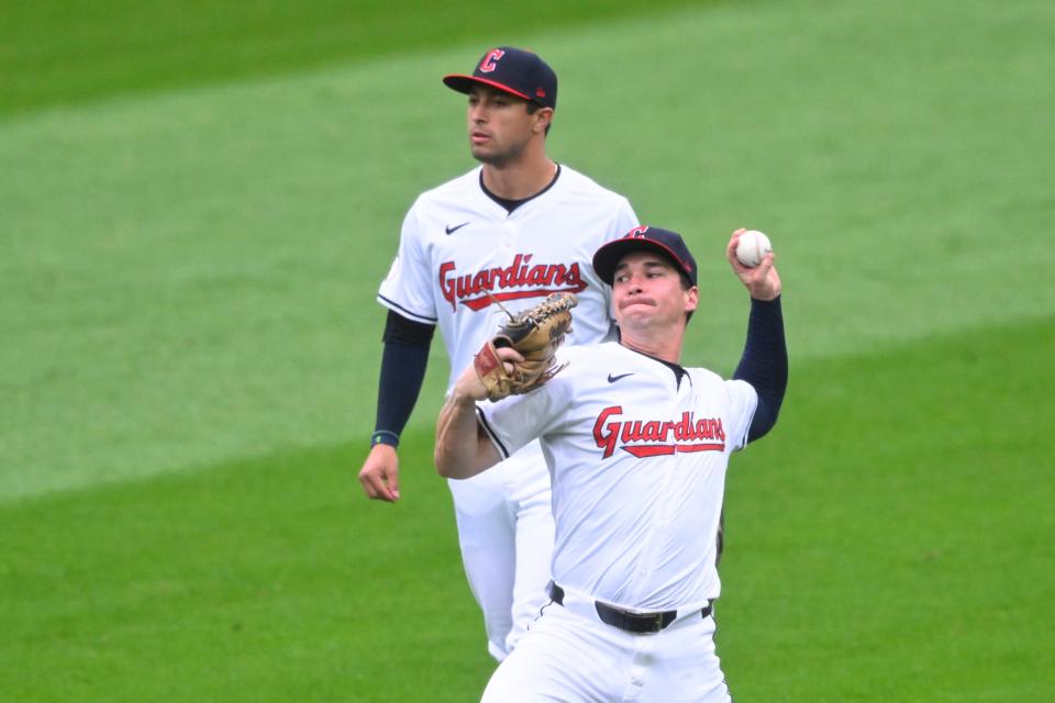 May 6, 2024; Cleveland, Ohio, USA; Cleveland Guardians right fielder Will Brennan (17) throws the ball to the infield beside center fielder Tyler Freeman (2) in the second inning against the Detroit Tigers at Progressive Field. Mandatory Credit: David Richard-USA TODAY Sports