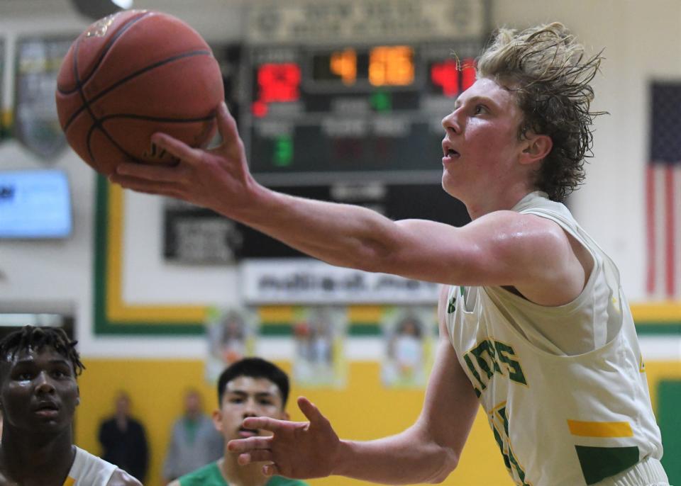 New Deal's Jason Brazell goes for a layup against Floydada on Tuesday, Feb. 1, 2022, at New Deal High School in New Deal.