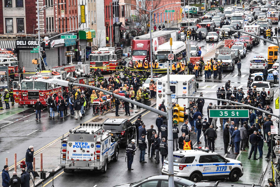 Image: Members of the New York Police Department and emergency vehicles crowd the streets after a rush-hour shooting at a subway station in Brooklyn, N.Y., on April 12, 2022. (Angela Weiss / AFP - Getty Images)