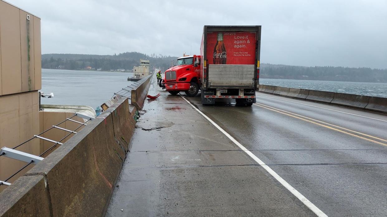 A Coca-Cola truck jackknifed on the Hood Canal Bridge on Friday afternoon and damaged a section of the bridge.