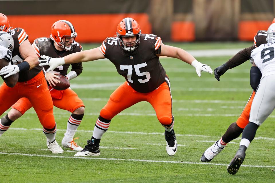 Cleveland Browns offensive guard Joel Bitonio (75) keeps watch during the first half of an NFL football game against the Las Vegas Raiders, Sunday, Nov. 1, 2020, in Cleveland. (AP Photo/Ron Schwane)