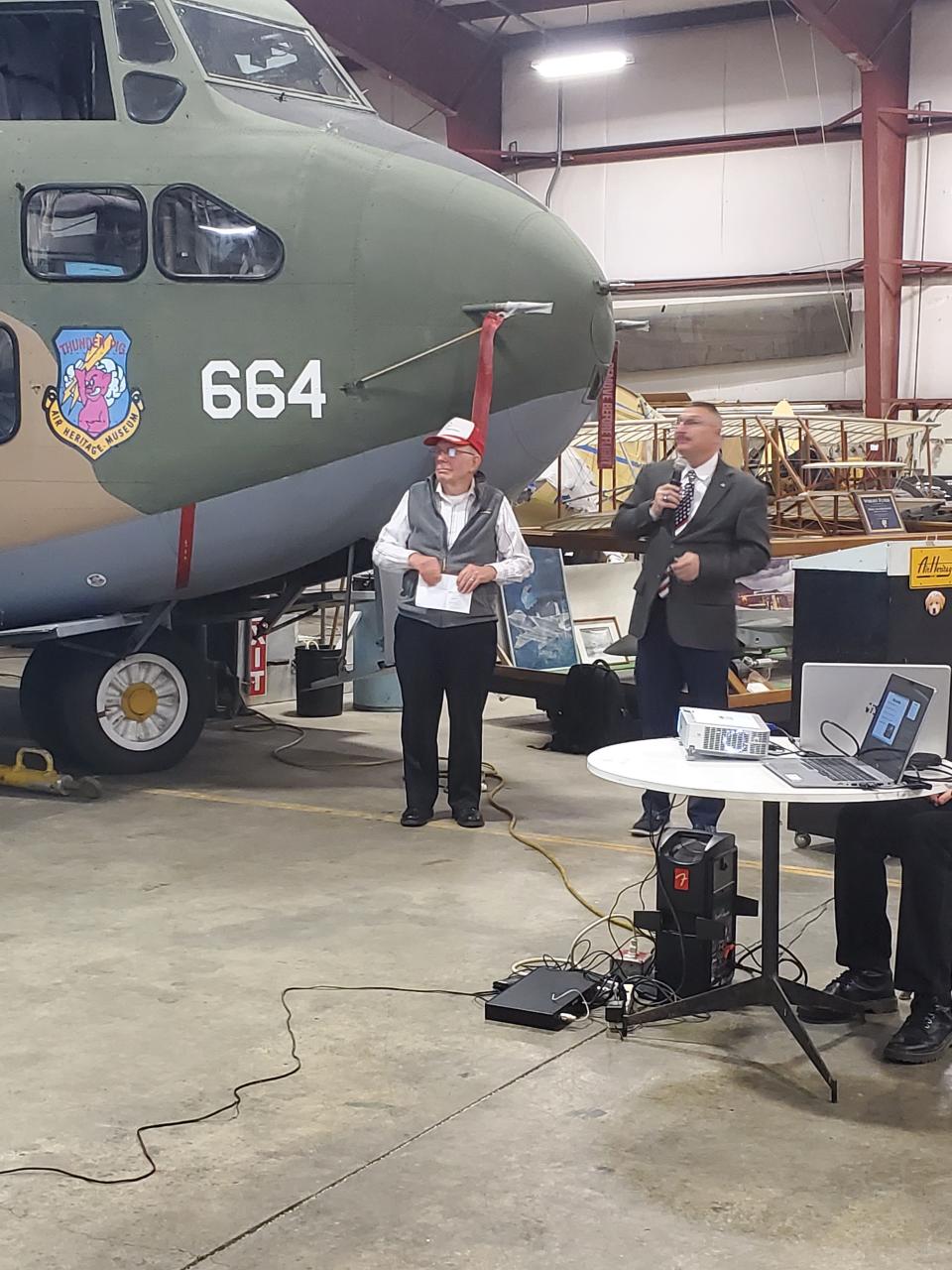 Gregory Werking of Ohioville receives his Charles Taylor Master Mechanic Award March 25 while standing in front of the 'Thunder Pig" plane he works on at the Air Heritage Museum in Chippewa Township.