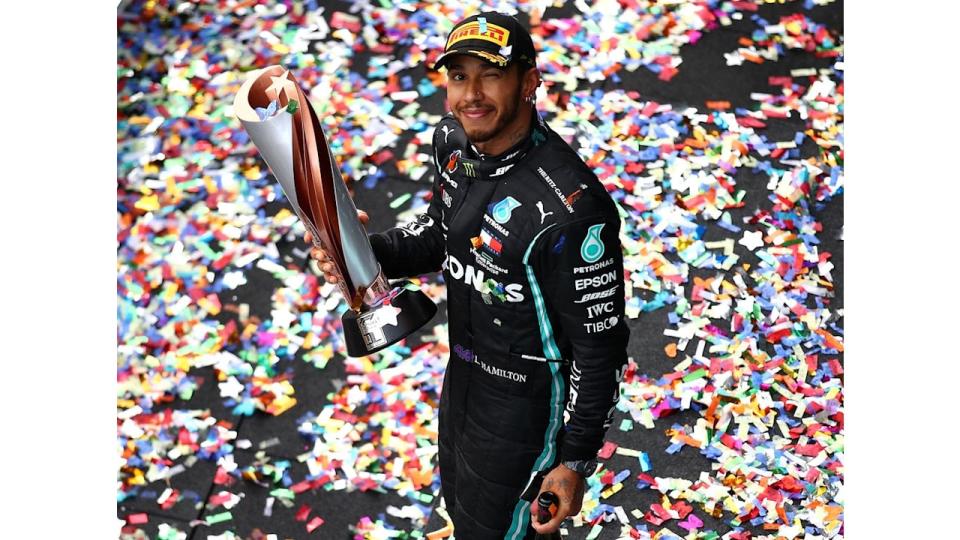 ISTANBUL, TURKEY - NOVEMBER 15: Race winner Lewis Hamilton of Great Britain and Mercedes GP celebrates winning a 7th F1 World Drivers Championship on the podium during the F1 Grand Prix of Turkey at Intercity Istanbul Park on November 15, 2020 in Istanbul, Turkey. (Photo by Bryn Lennon/Getty Images)