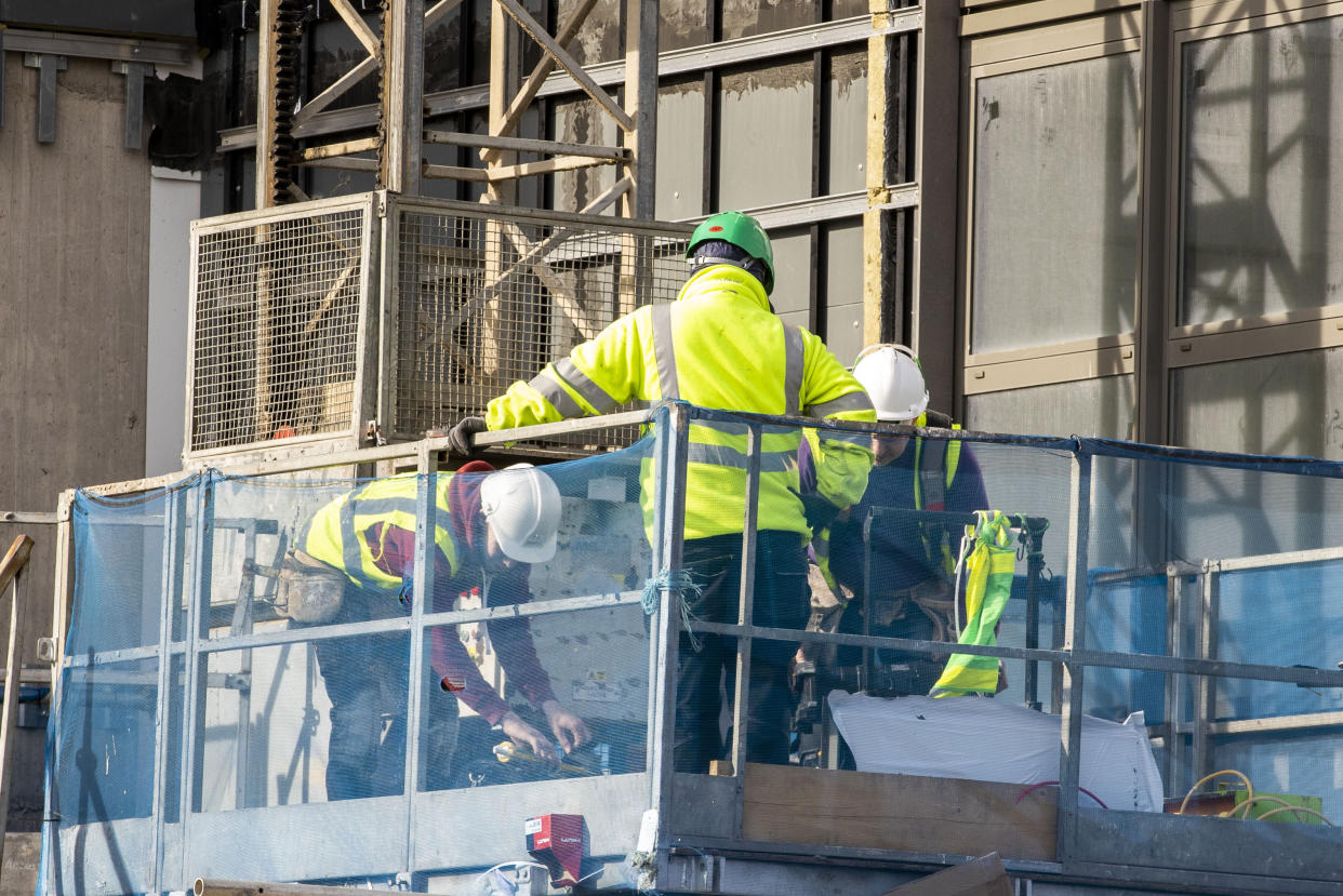 Constructions workers on a building site in Belfast.