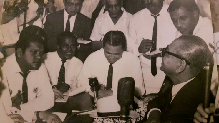 Photo of Othman Wok (middle seated) at a press conference on 17 November 1962 with Malaysia’s first prime minister, Tunku Abdul Rahman (right seated) courtesy of Lily Othman.