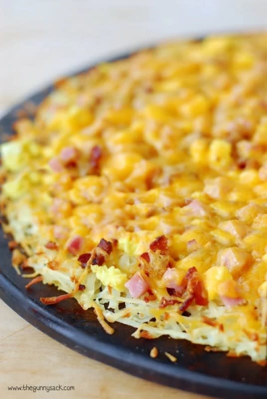 <p>This delicious recipe for breakfast pizza with a hash brown crust topped with bacon, ham, and cheese can be made for breakfast or as an easy dinner. </p><p><strong>Get the recipe: <a href="https://www.thegunnysack.com/breakfast-pizza-hash-brown-crust/" rel="nofollow noopener" target="_blank" data-ylk="slk:Breakfast Pizza with Hashbrown Crust;elm:context_link;itc:0;sec:content-canvas" class="link rapid-noclick-resp">Breakfast Pizza with Hashbrown Crust</a></strong></p>