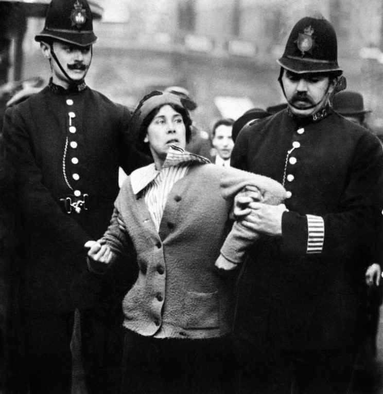 A female suffragette being lead away by police [Photo: PA Images]