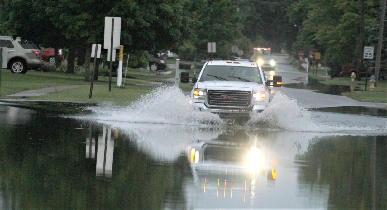 Linden Avenue, in Gibsonburg, was one of many flooded streets in Gibsonburg Tuesday. Many residents lost power, as storms dumped heavy rains in Sandusky and Ottawa County on Monday night.
