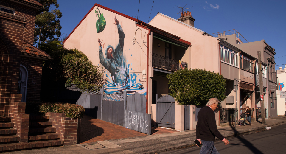 Church street in Newtown, in Sydney's Inner West, showing a mural titled Flood Emergency Drop.. 