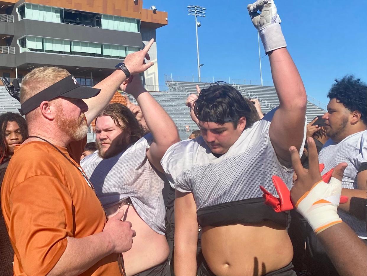 Hutto football coach Will Compton, leading his team during a practice break, said receiver Alex Green and quarterback Will Compton are "self-motivated" to do whatever it takes to succeed. The Hippos play Duncanville in a playoff game Friday.