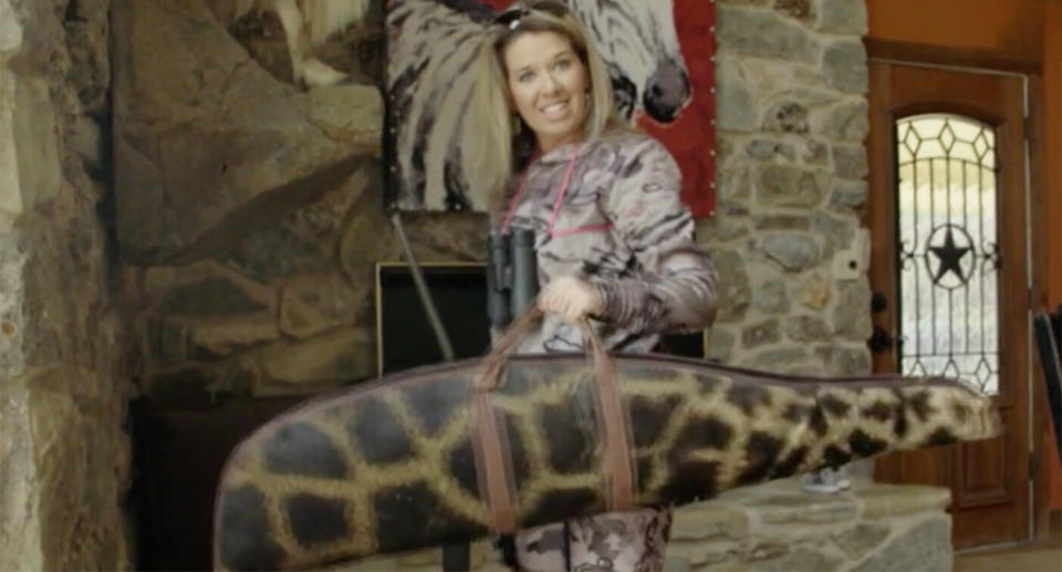 Ms Talley holds up the gun case she made out of the giraffe's hide.