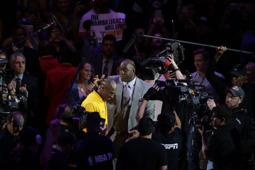 Kobe Bryant and Magic Johnson before Bryant's last game as a Laker against Utah on April 13, 2016, at Staples Center.