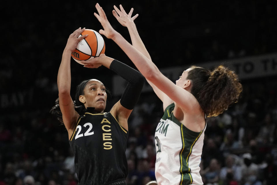 Las Vegas Aces forward A'ja Wilson (22) shoots over Seattle Storm forward Breanna Stewart (30) during the first half in Game 2 of a WNBA basketball semifinal playoff series Wednesday, Aug. 31, 2022, in Las Vegas. (AP Photo/John Locher)