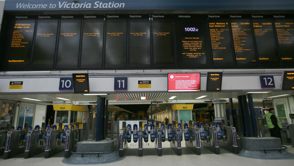 The information boards at Victoria train station show cancelled or delayed trains due to bad weather in London, Tuesday, Dec. 24, 2013.  A severe winter storm has caused major travel problems in Britain, leading to substantial delays Tuesday at London Gatwick Airport and on roads and rail lines at the height of the Christmas travel period. Gatwick Airport said its North Terminal is having "significant power outages" and advised passengers to check flight status before traveling to the airport. (AP Photo/Alastair Grant)