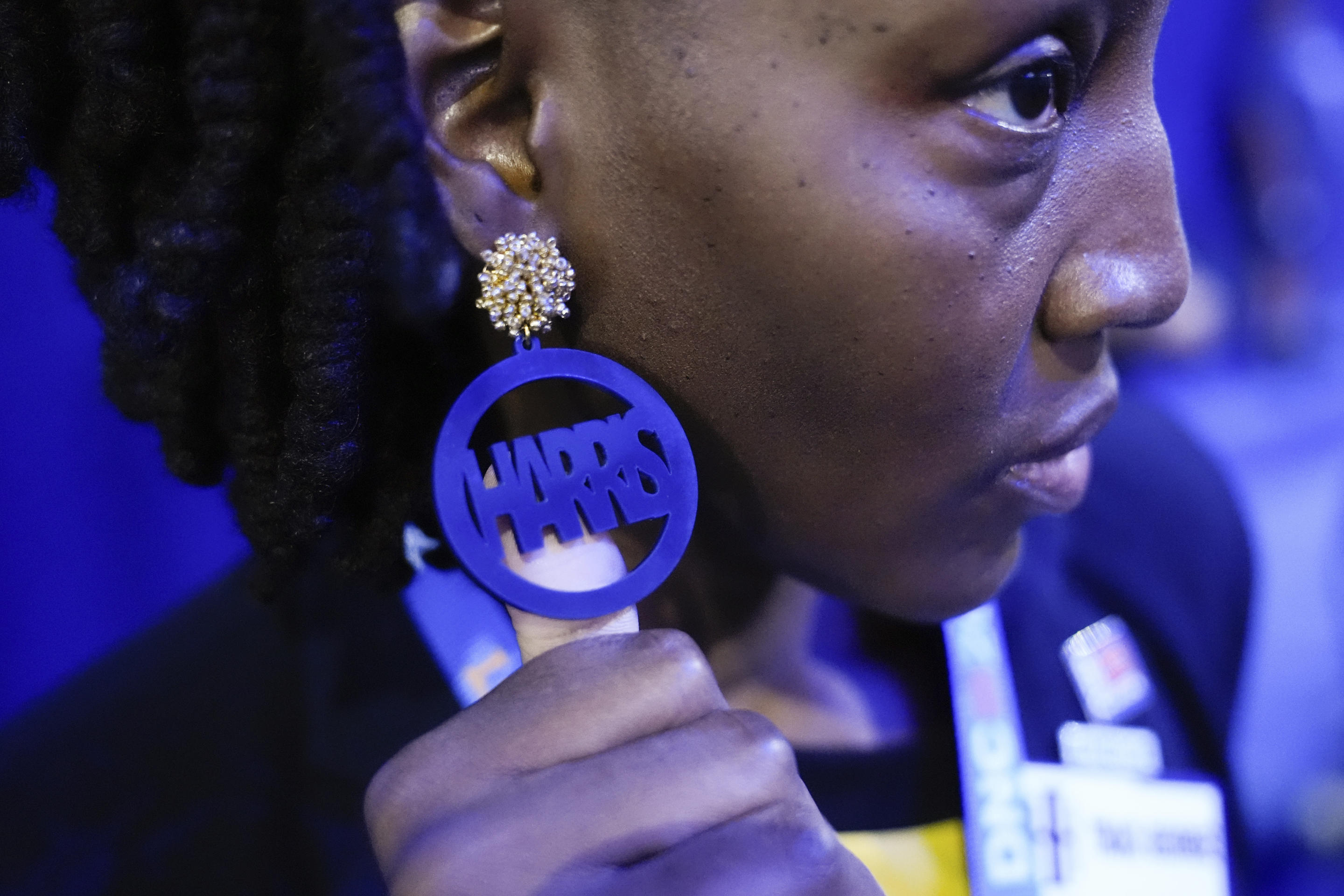 A delegate wears a Harris earring at the convention on Tuesday. (Brynn Anderson/AP)