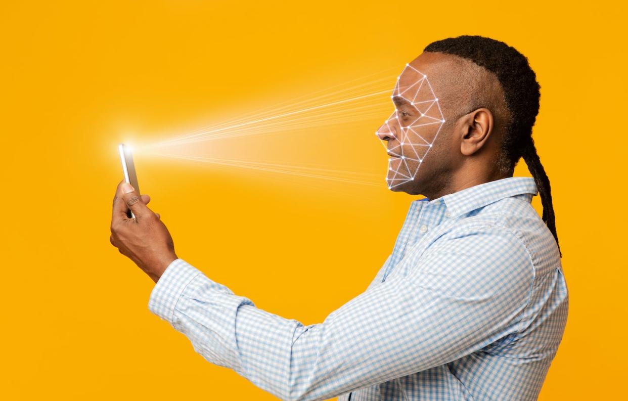 Many AI algorithms, like facial recognition software, have been shown to be discriminatory to people of color. <a href="https://www.gettyimages.com/detail/photo/mature-african-man-scanning-his-face-with-mobile-royalty-free-image/1209011777?phrase=facial%20recognition%20black%20person&adppopup=true" rel="nofollow noopener" target="_blank" data-ylk="slk:Prostock-Studio/iStock via Getty Images;elm:context_link;itc:0;sec:content-canvas" class="link ">Prostock-Studio/iStock via Getty Images</a>