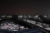 Indian passengers wait on platforms at a railway station in Allahabad, India.