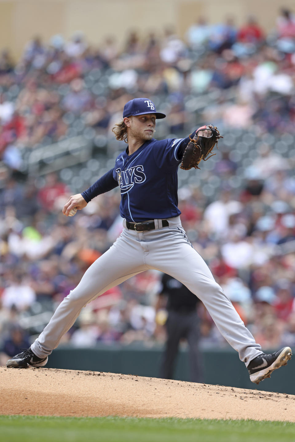 Tampa Bay Rays starting pitcher Shane Baz (11) throws during the first inning of a baseball game against the Minnesota Twins, Saturday, June 11, 2022, in Minneapolis. (AP Photo/Stacy Bengs)