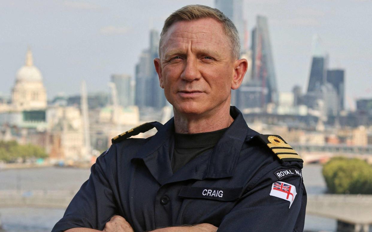 Commander Daniel Craig, who is best known for playing the role of James Bond in the long running 007 film series, on his receiving the honorary Royal Navy rank of Commander from the Head of the Royal Navy, First Sea Lord Admiral Sir Tony Radakin - LEE BLEASE /AFP