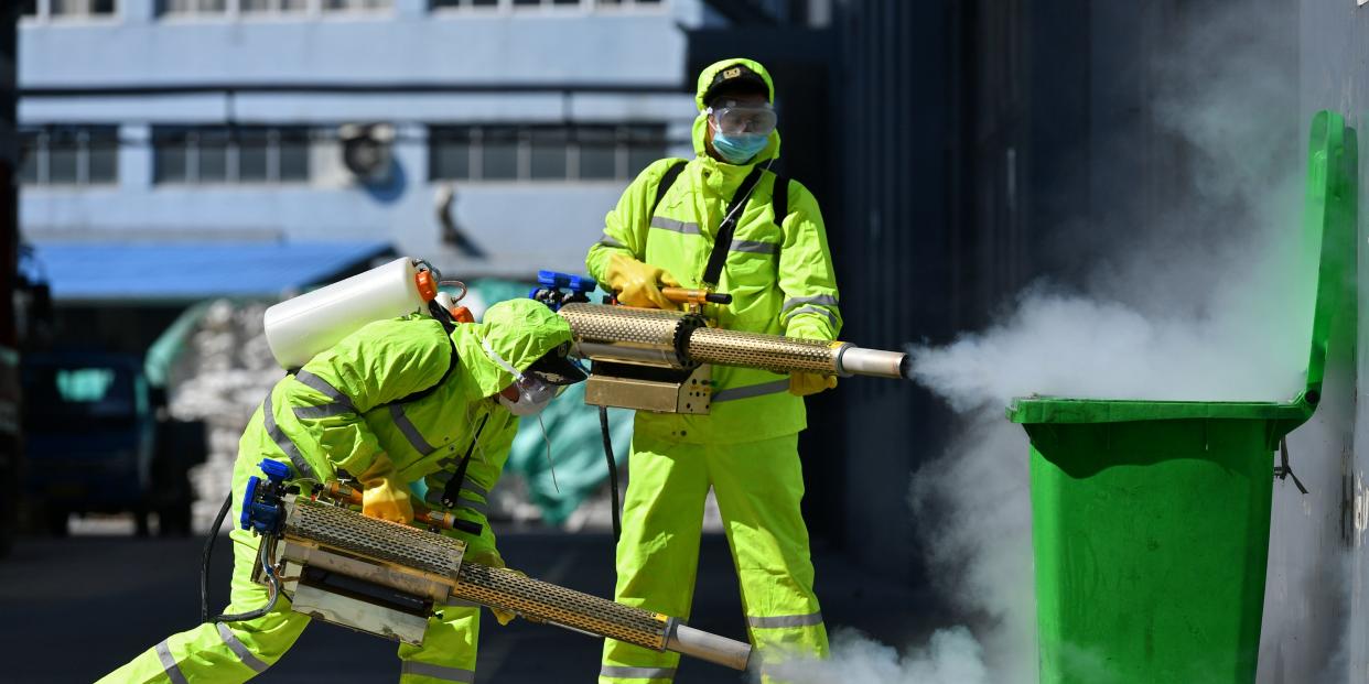 Volunteers in protective suits disinfect a factory with sanitizing equipment, as the country is hit by an outbreak of the novel coronavirus, in Huzhou, Zhejiang province, China February 18, 2020. China Daily via REUTERS 