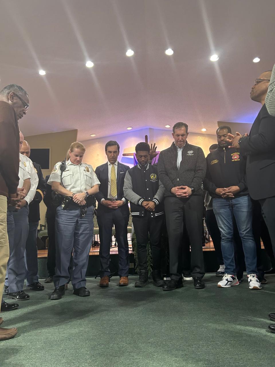 Baltimore officials such as Baltimore County Executive John “Johnny O” Olszewski, Jr., and Mayor Brandon Scott attend a prayer vigil at Mt. Olive Baptist Church of Turner Station. In the early hours of Tuesday morning, a large cargo ship struck the Francis Scott Key Bridge, causing it to partially collapse. A massive search effort stretched into Tuesday afternoon for six construction workers who were on the bridge at the time of the collapse.