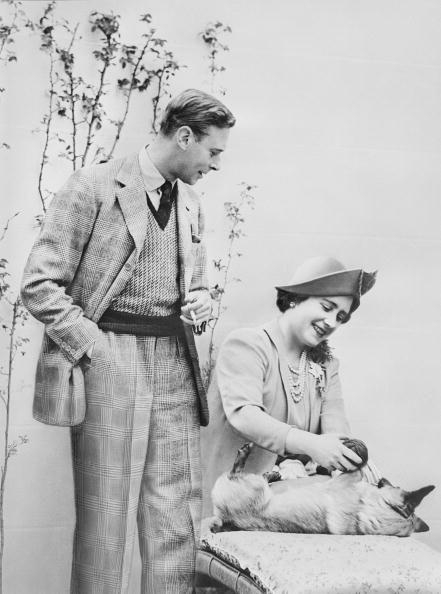 <p>King George VI and the Queen Mother spending some quality time with their four-legged family member.</p>