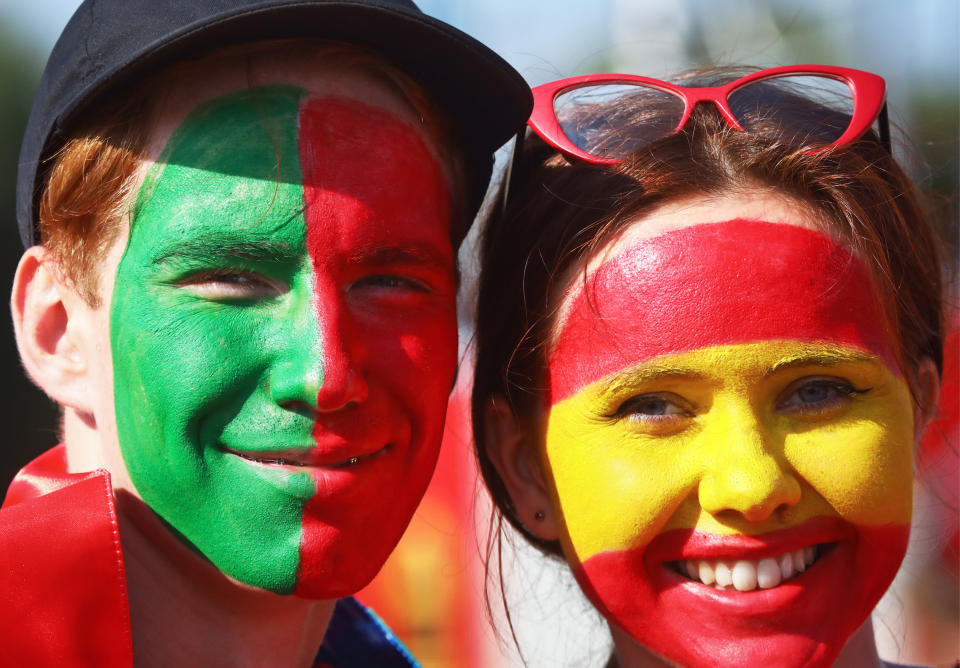 <p>Portugal’s and Spain’s football fans with national flags painted on their faces seen outside Fisht Stadium ahead of their 2018 FIFA World Cup Group B match. Sergei Malgavko/TASS (Photo by Sergei Malgavko\TASS via Getty Images) </p>