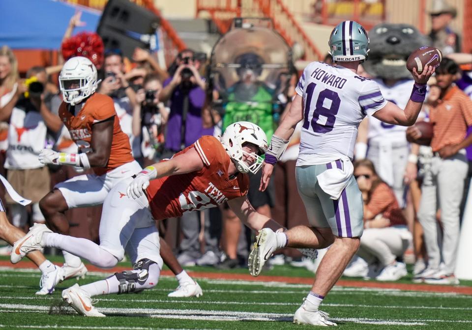 Texas defensive end Ethan Burke closes in on Kansas State quarterback Will Howard on Saturday. Burke finished with two sacks in the 33-30 overtime win.