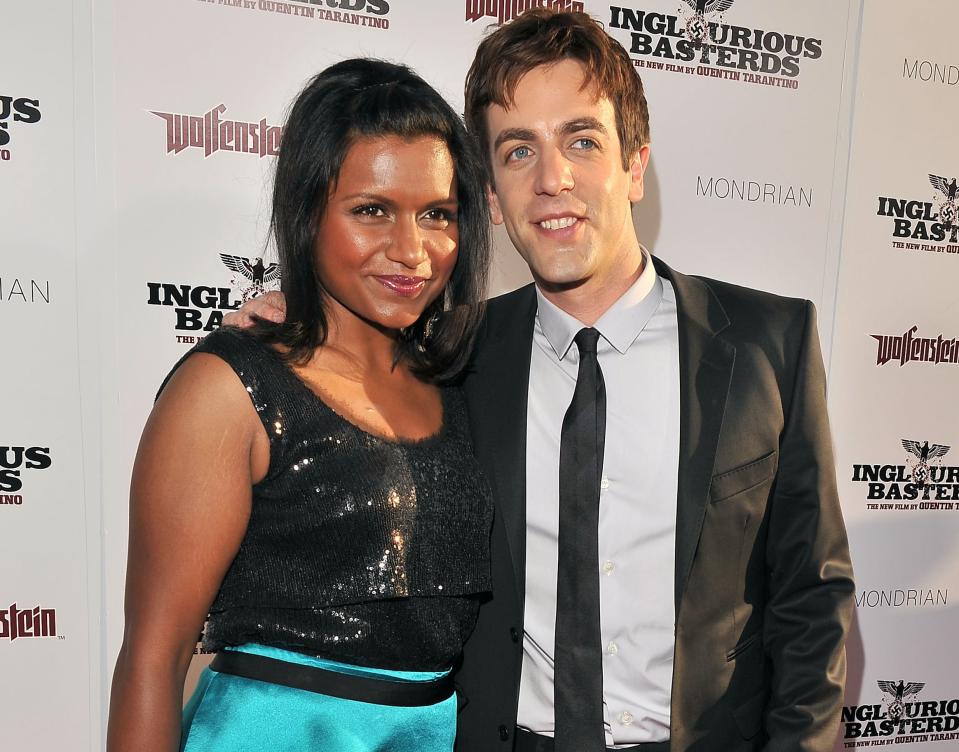 A close-up of Mindy and BJ, who has his hand on her shoulder