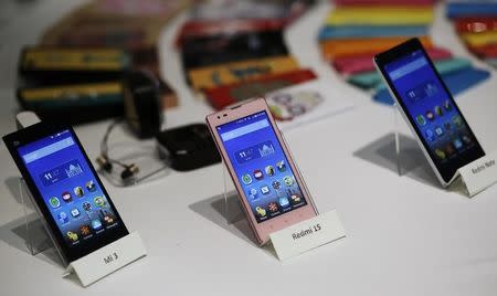 Three models of China's Xiaomi Mi phones are pictured during their launch in New Delhi July 15, 2014. REUTERS/Anindito Mukherjee/Files