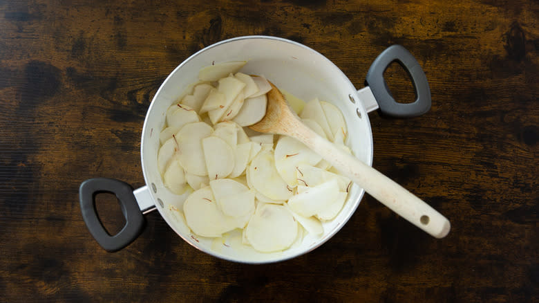 sliced turnips in white saucepan