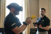 VR equipment and a version of the TASER 7 that utilizes VR technology for training, is demonstrated, Thursday, May 12, 2022, in Washington. (AP Photo/Jacquelyn Martin)