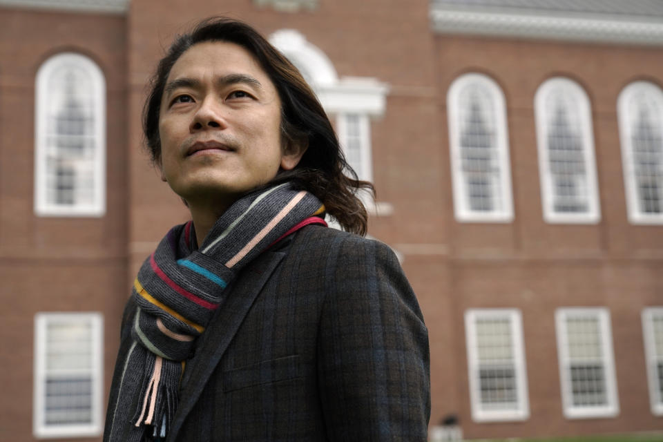 Eng-Beng Lim, a professor at Dartmouth College, stands for a photograph on the school's campus, Tuesday, April 20, 2021, in Hanover, N.H. A wave of anti-Asian attacks that started more than a year ago with the pandemic, along with the March 2021 shootings in Atlanta that left six Asian women dead, have provoked national conversations about the visibility of Asian Americans. (AP Photo/Steven Senne)