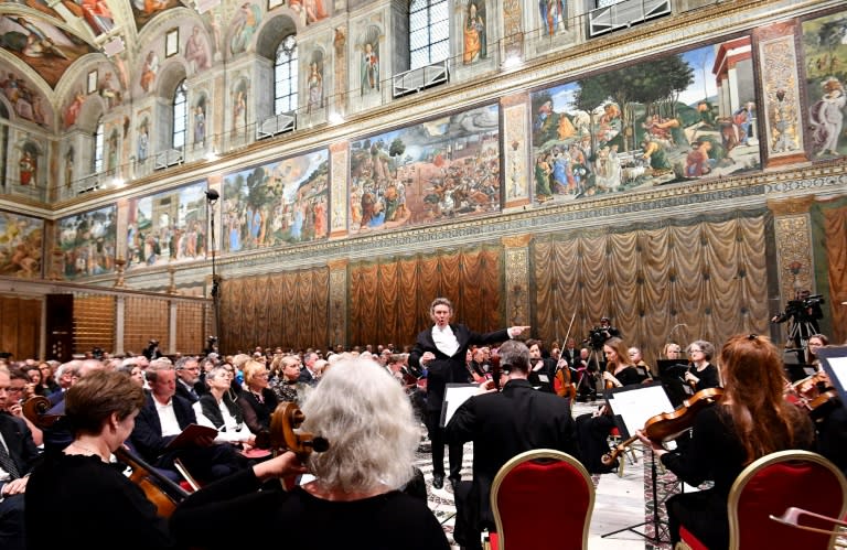 Some 300 people filled the Sistine Chapel for the concert as people around the world watched the live video streamed on the web